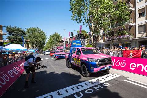The truck mounts are escorted by a Mollo Noleggio 4x4 pick-up during the Race in Pink parade